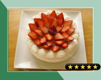 A Patissier's Cake Decorated With Lots of Strawberries recipe
