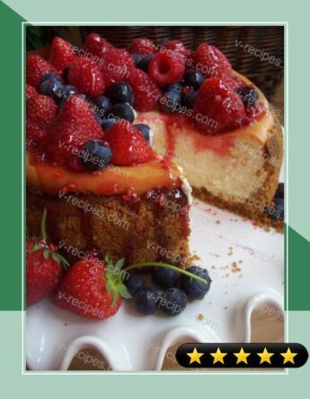 Vanilla Bean Cheesecake with Fresh Berries and Honey Drizzle recipe